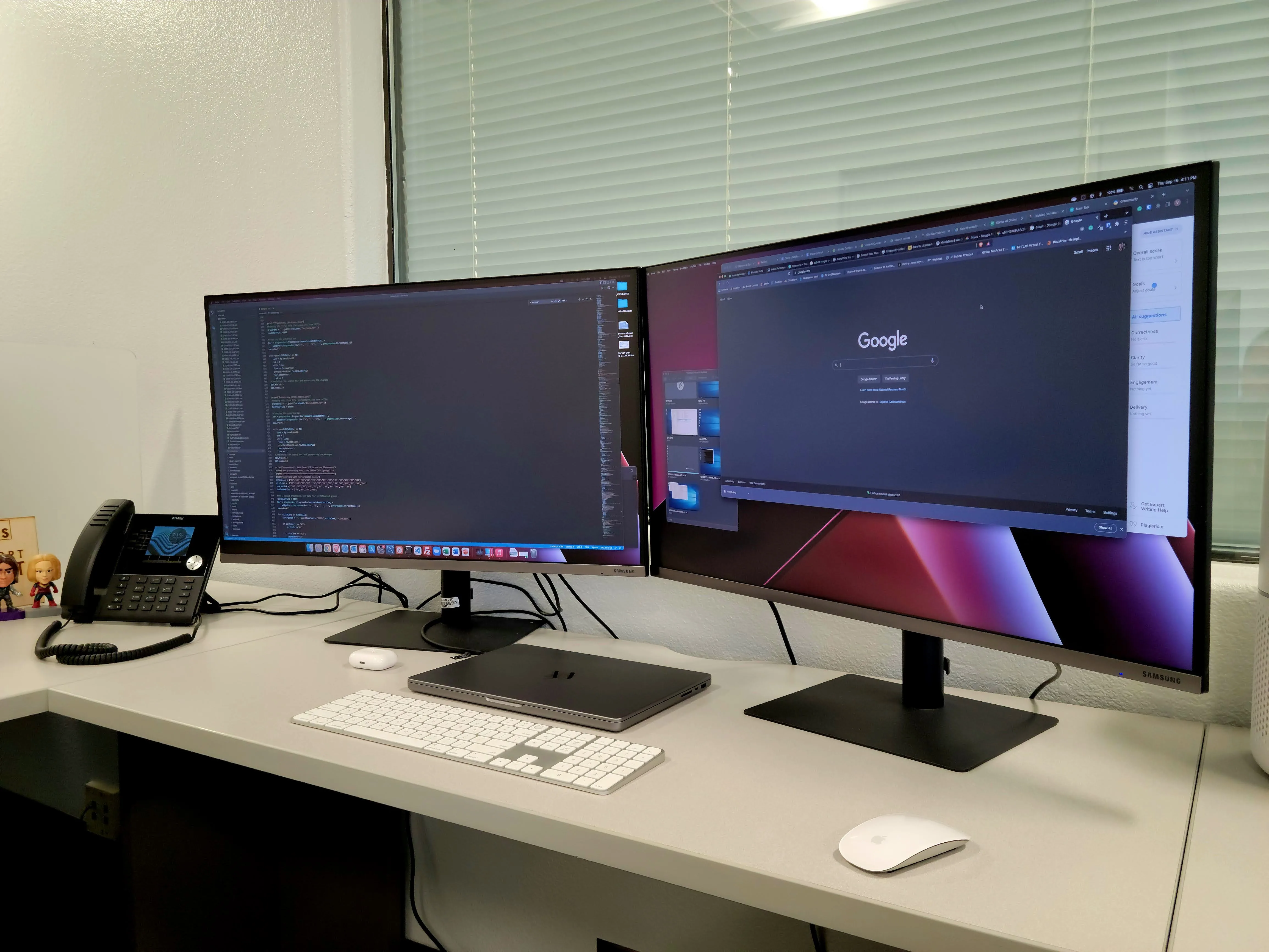 Two computer monitors, a keyboard and a mouse on a wooden desk