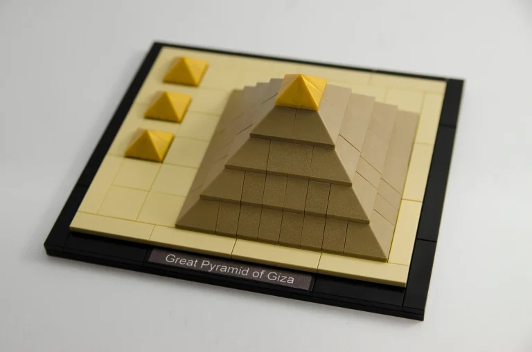 Physical LEGO model of the Great Pyramid of Giza with three smaller pyramids on a black edged base