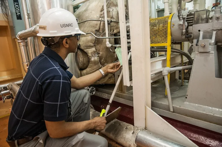 A Nuclear Regulatory Commission inspector checks equipment at Calvert Cliffs in May 2012