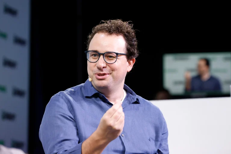 Dario Amodei speaking onstage at TechCrunch Disrupt in September 2023