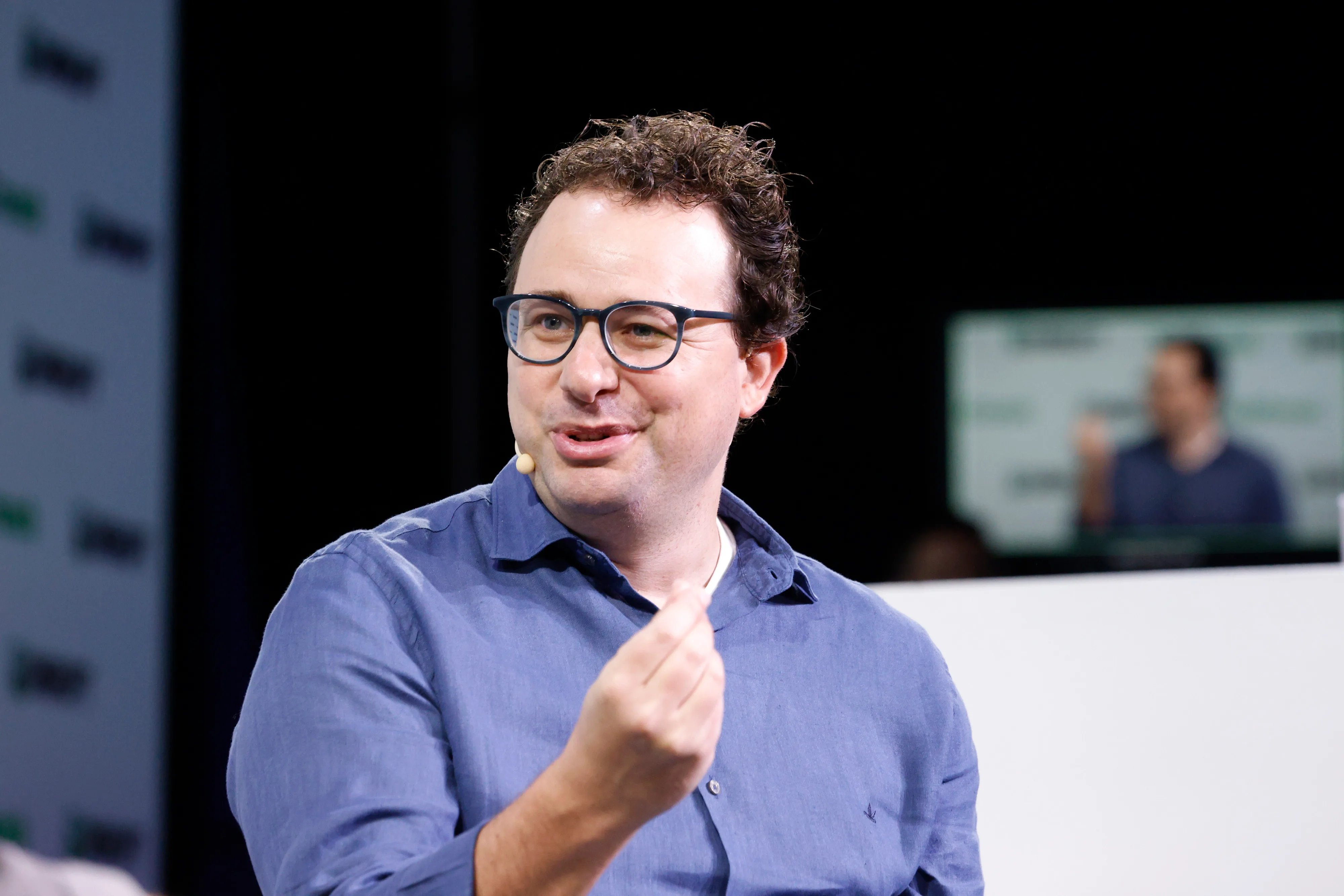 Dario Amodei speaking onstage at TechCrunch Disrupt in September 2023