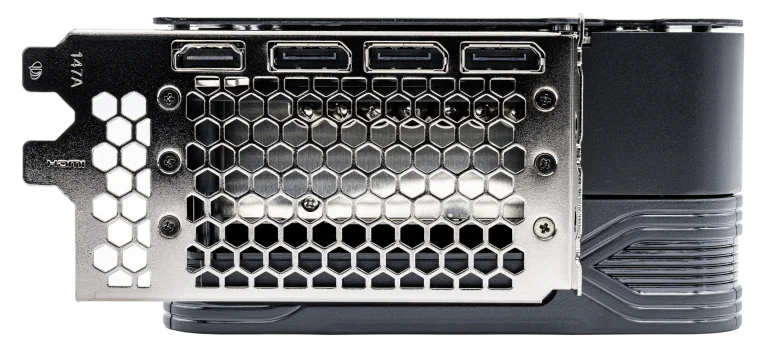 Four display connectors above a honeycomb ventilation grille on the metal rear plate of a graphics card