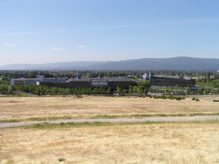 Google headquarters buildings in Mountain View photographed across an open field in 2009
