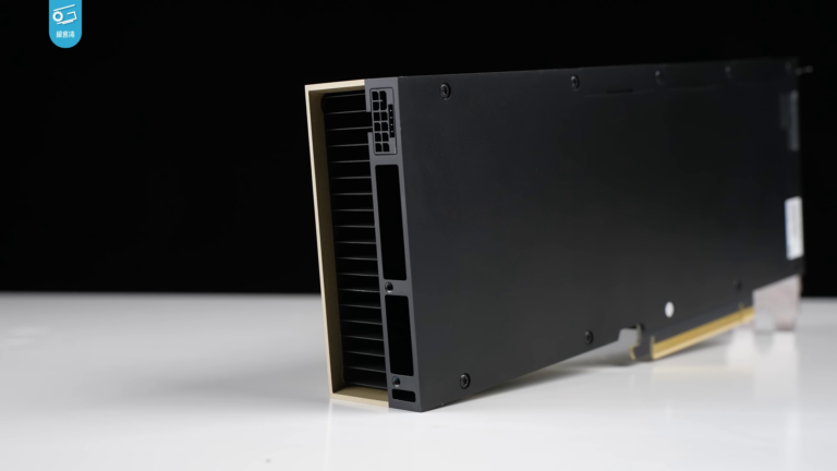 Rear view of an NVIDIA H100 accelerator on a white surface with the Geekerwan watermark in the upper left