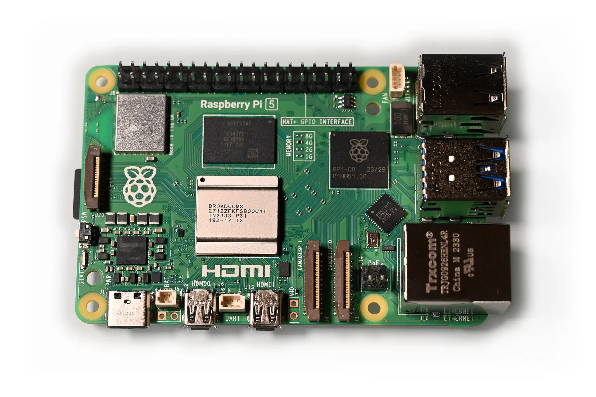 A green Raspberry Pi 5 board with its chips and connectors visible on a white background