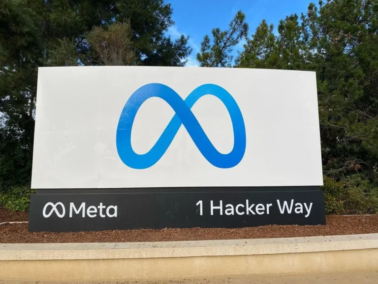 Meta logo and company name on the entrance sign at 1 Hacker Way