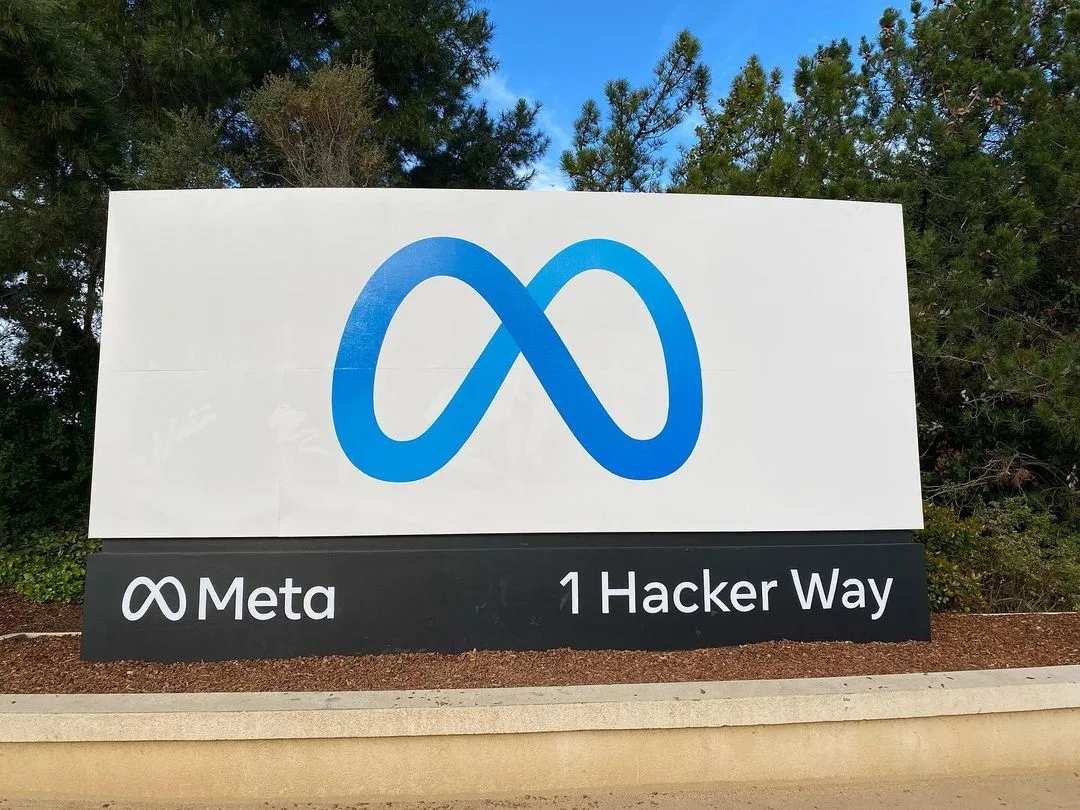Meta logo and company name on the entrance sign at 1 Hacker Way