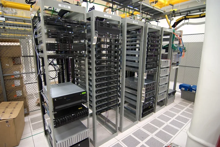 Rows of server racks and network equipment in a computer room