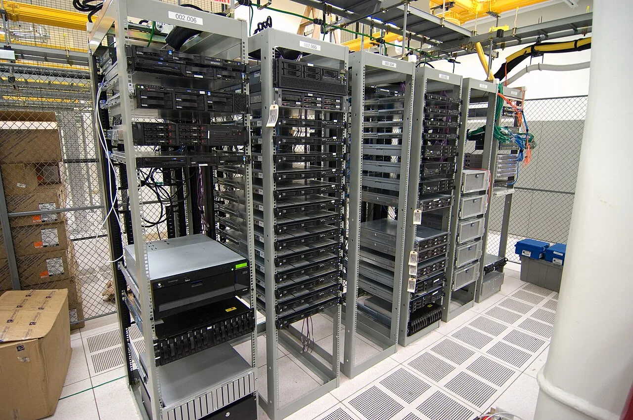 Rows of server racks and network equipment in a computer room
