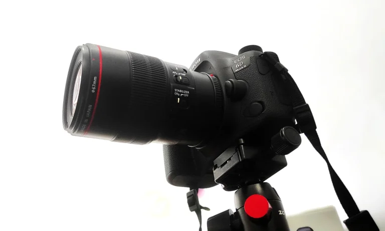 Canon EOS 6D Mark II camera with a large macro lens mounted on a tripod